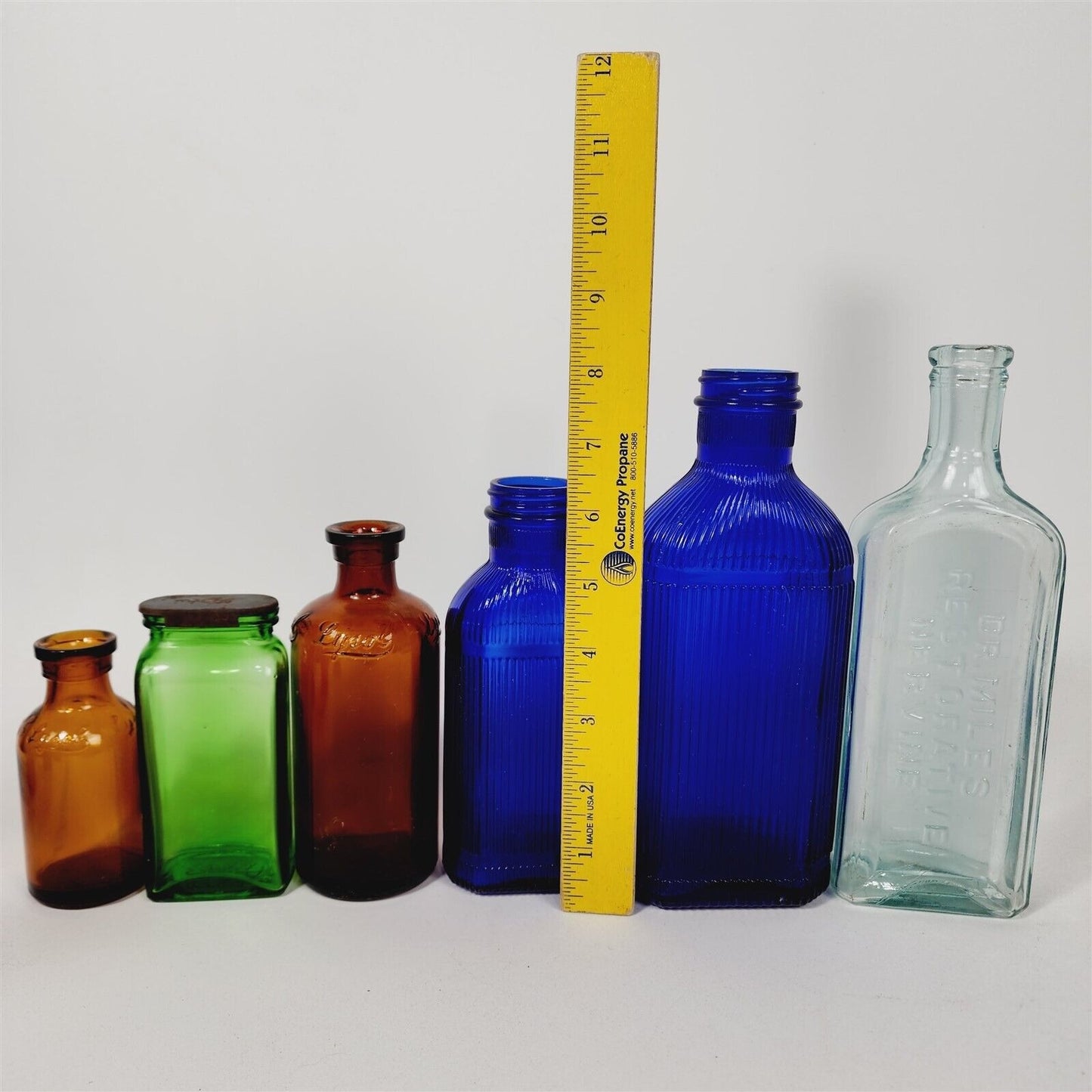 10 Vtg Bottles Colorful Fitch's Lysol Rawleigh Dr Miles Seltzer Blue Brown Green